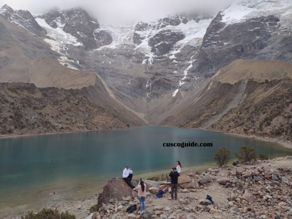 Humantay Lake, nestled in the Andean mountains, with its vibrant turquoise waters surrounded by snow-capped peaks in Peru.